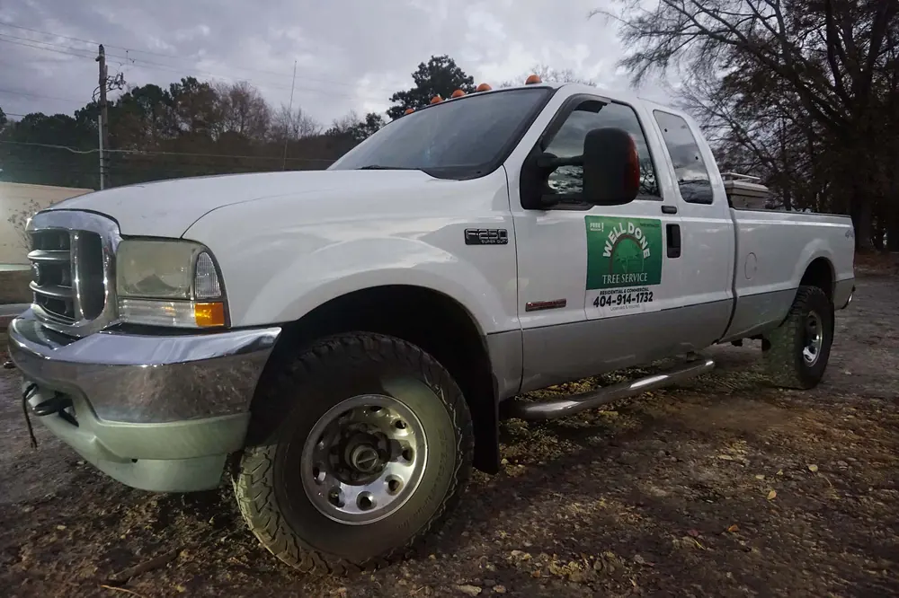 Well Done Tree Service crew pickup truck, licensed and insured, at the equipment yard